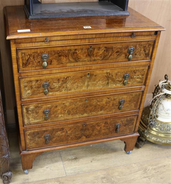 A walnut crossbanded chest of drawers W.71cm